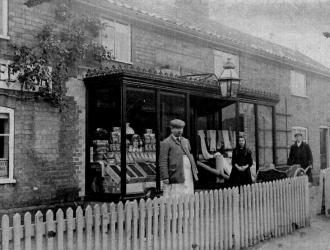 Mr.Roland Button who fought in WW1 outside shop in New Street which is now the Mace.