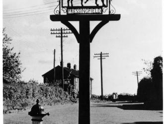 The old  village sign replaced in 2002 and now at the school.